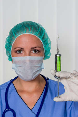 a nurse in surgical clothing before surgery. symbolic photo for work in the hospital.の写真素材