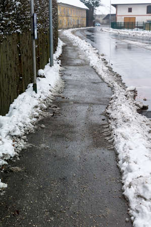 snow on walkwayの写真素材