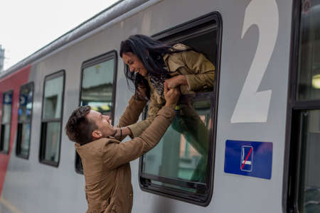 Couple saying good bye in the trainの写真素材
