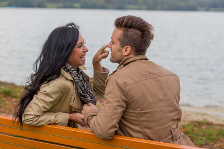 amorous couple on a park benchの写真素材