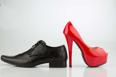red high heels and mens shoeの写真素材