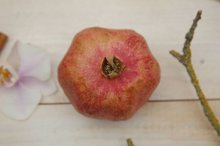 Pomegranate and wood backgroundの写真素材