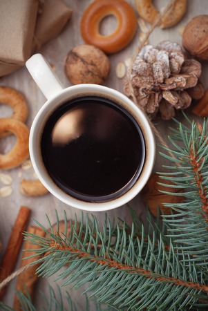 White Christmas decor: warm sweater, cup of hot coffee, or cocoa. Winter mood, holiday decoration.の写真素材