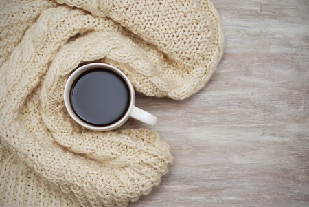 Christmas decor: warm sweater, cup of hot coffee. Winter mood, holiday background.の写真素材
