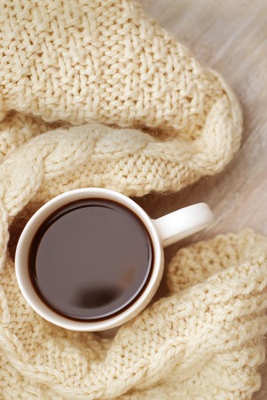 Christmas decor: warm sweater, cup of hot coffee. Winter mood, holiday background. Vertical.の写真素材