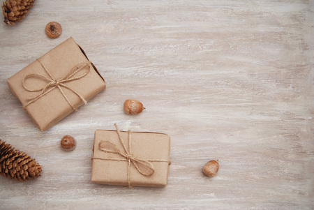Rustic gift kraft boxes with ribbon bow, with pineconeの写真素材