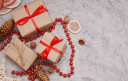 many gifts wound kraft paper, branches ate on a tableの写真素材