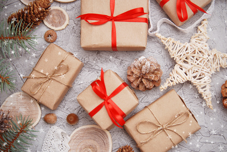 Christmas presents on a wooden table with copy space. View from above.の写真素材