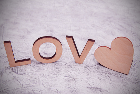 Wooden love letters on gray background wooden heart for Valentines background and love theme.の写真素材