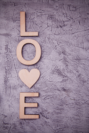 Vertical wooden love letters rustic gray background. toned.の写真素材