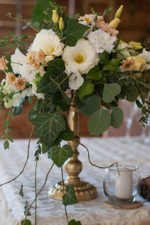 Flower composition on gold. Wedding decoration. floristry.の写真素材