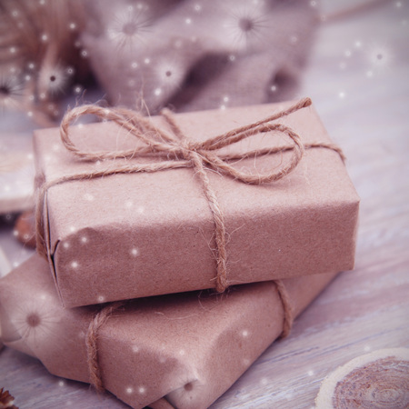 Gift box wrapped in brown recycled paper and tied sack rope top view isolated on white background, clipping path includedの写真素材