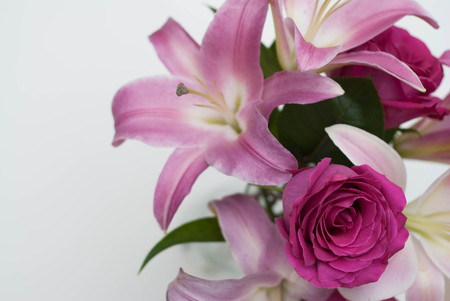 Pink bouquet with roses and lily. greeting background.の写真素材