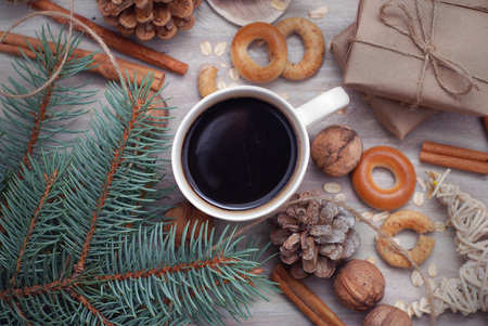 Arrangement of Christmas winter foliage with coffee cup. Holiday background. Holiday Christmas still life with cup of coffee, chocolateの写真素材