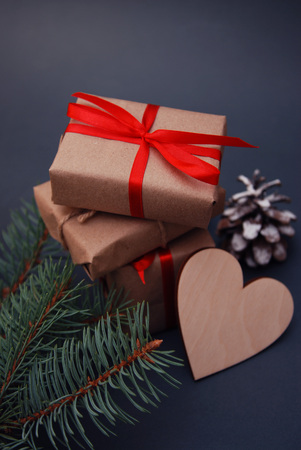 Fir pine Branches, Kraft Gift Heart. Top view. Christmas holyday concept. Vertical image.の写真素材