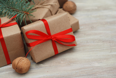 Gift Box wrapped in Brown kraft paper with Red Ribbon bowの写真素材