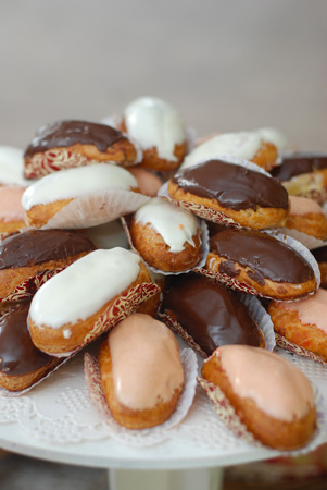 French dessert with Chocolate Eclairs stuffed with cream at a partyの写真素材