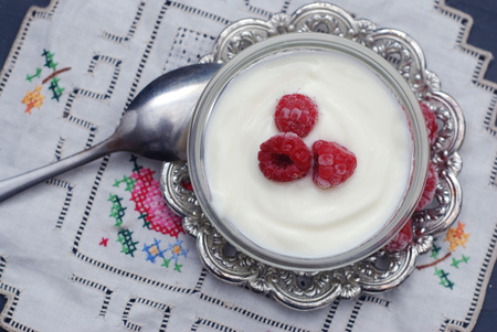 Natural yogurt with fresh raspberries. sweet breakfastの写真素材