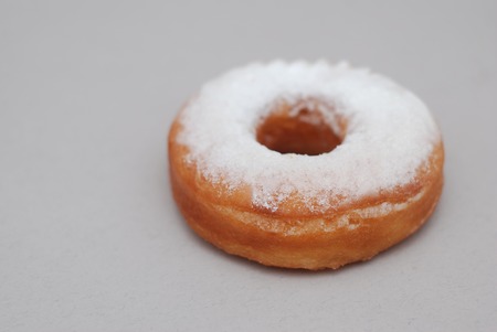 Sugar Ring Donut Isolated on a gray tableの写真素材