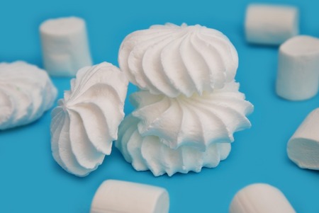 Heap of Meringues in over Blue Backgroundの写真素材