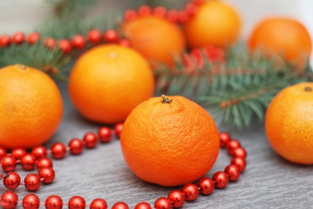 Tangerines, fir tree brunches, pine cones andの写真素材