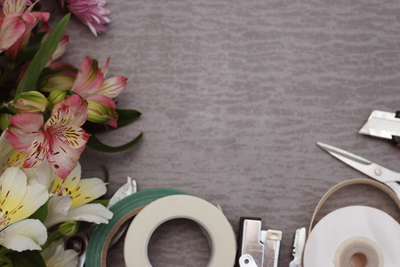 Tools and Accessories Florists need for Making up a Bouquet on Gray Wooden Surface, Concept, florist workplace, flat layの写真素材