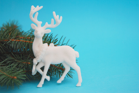 White Decorative Cristmas Reinder with Fir treeの写真素材