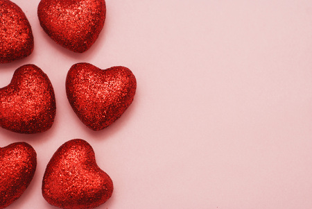 Close Up Red Hearts Over Pink Background with Copy Space. Happy Valentine Day Template Greeting Cart.の写真素材