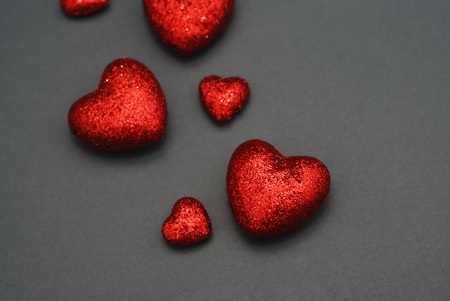 Red Glitter Hearts on Gray Background in Love Concept for Valentines Day with Sweet and Romanticの写真素材