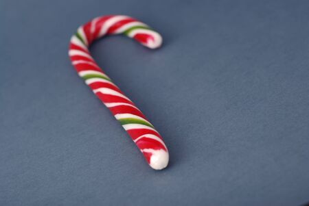 Traditional Christmas Candy Stick Isolated on Gray Backgroundの写真素材