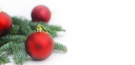 Isolated Fir Branches with Christmas Red Tree Balls with Copy Paste. Baner.の写真素材