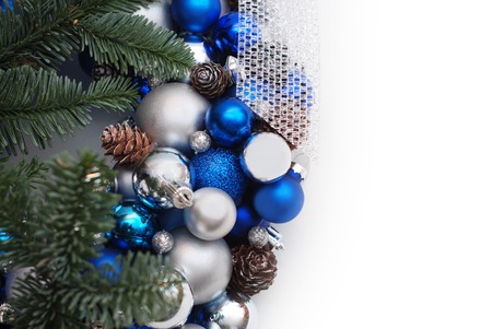 Christmas Winter Decoration Wreath background. Blue and Silver Globes or Balls with Fir Branches, Isolated on White.の写真素材
