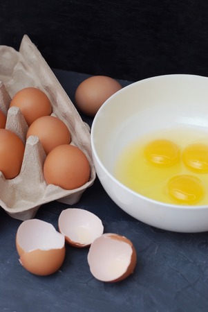 Raw Eggs in Bowl on Kitchen Table