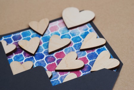 Valentines Day Blue Colorful Envelope, Wooden Laser Cut Heart. Valentine and Love Concept. Vintage white wood background.の写真素材