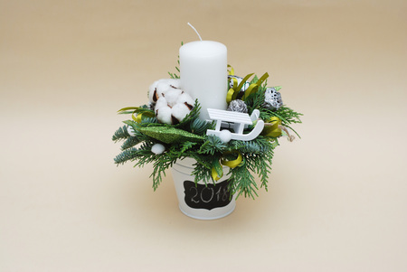 Christmas Composition with fir sprigs, Cotton Flowers, Sleigh, Candle on Neutral Background. Copy Space.の写真素材