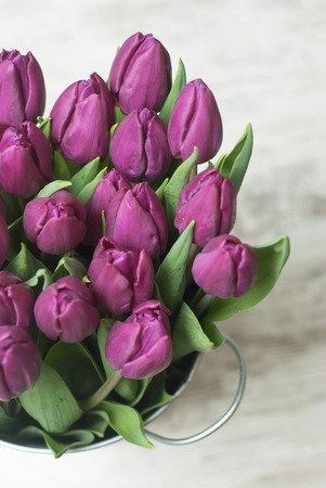 Top view of Purple Flower Bouquet in Metalic Vase on Gray Rustic Background. Spring, Summmer flowers.の写真素材