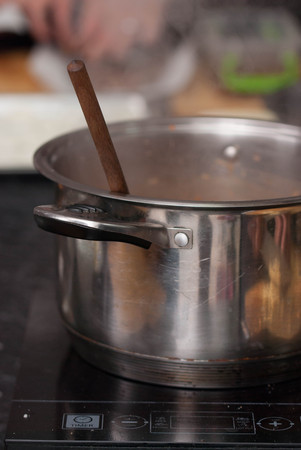 Saucepan and Wooden Spoon. Restaurant Kitchen with Equipment for Cooking.の写真素材