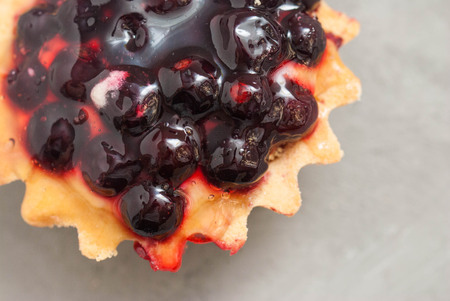 Top View of Tarttlet or Basket with Berries. Sweet Dessert Isolatedの写真素材