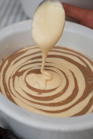 Cooking Pancake on Kitchen Background. Metal Spoon Mixing Liquid Doughtの写真素材