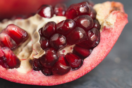Pomegranate Slice Fruit. Close up Granate Seeds in slice. Macro image. vitamine and Healthy concept.の写真素材