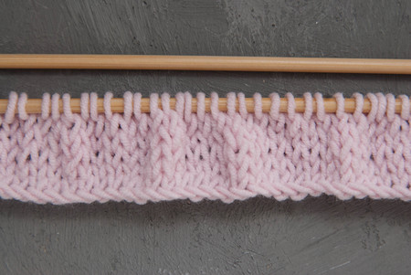 Two Knitting Wooden Needles in Corner of image with copy space for Text. Knitting Process. Hobby and Handmade.の写真素材