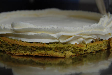 Pastry Bag with White Strawberry Cream Putting Cream Decorations over Cake. Cake cooking Proces. Step by Step.の写真素材