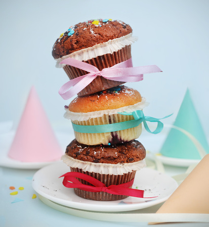 Three Muffins on top of Each Other Tied with Ribbons. Party Concept. cones. Square Imageの写真素材