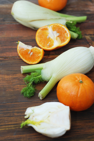 Fennel Vegetable Isolated. Fennel and Orange Citrus Fruit over Wooden Background.の写真素材