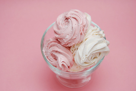 Close Up Pink Homemade Strawberry Marshmallows or Zephyr. Pink Desert over Pink Backgroundの写真素材
