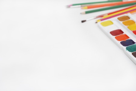 Top view of Work Process Blank Watercolor Paper pad, Watercolor Painting Supplies, Brushes and Colorful Pencil. Creation process of watercolor painting.の写真素材