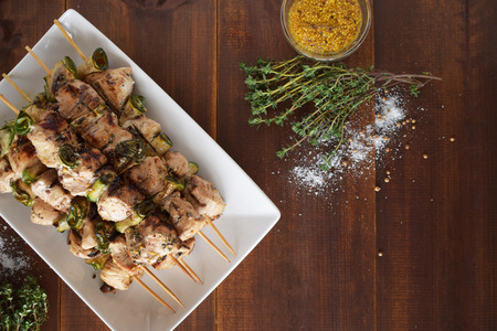Grilled Chicken Skewers. Barbeque Summer Picnic Food. Grilled Meat over Wooden Background with Spicesの写真素材