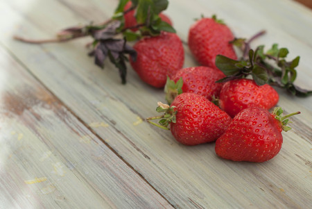 Strawberries on Wooden Background. Summer or Spring Organic Berry over Wood. Isoaltedの写真素材