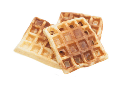 Freshly baked belgium waffles isolated on white backgroundの写真素材