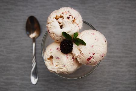 Homemade Berry Ice Cream Scoops Gray Textured Background mint Leavesの写真素材